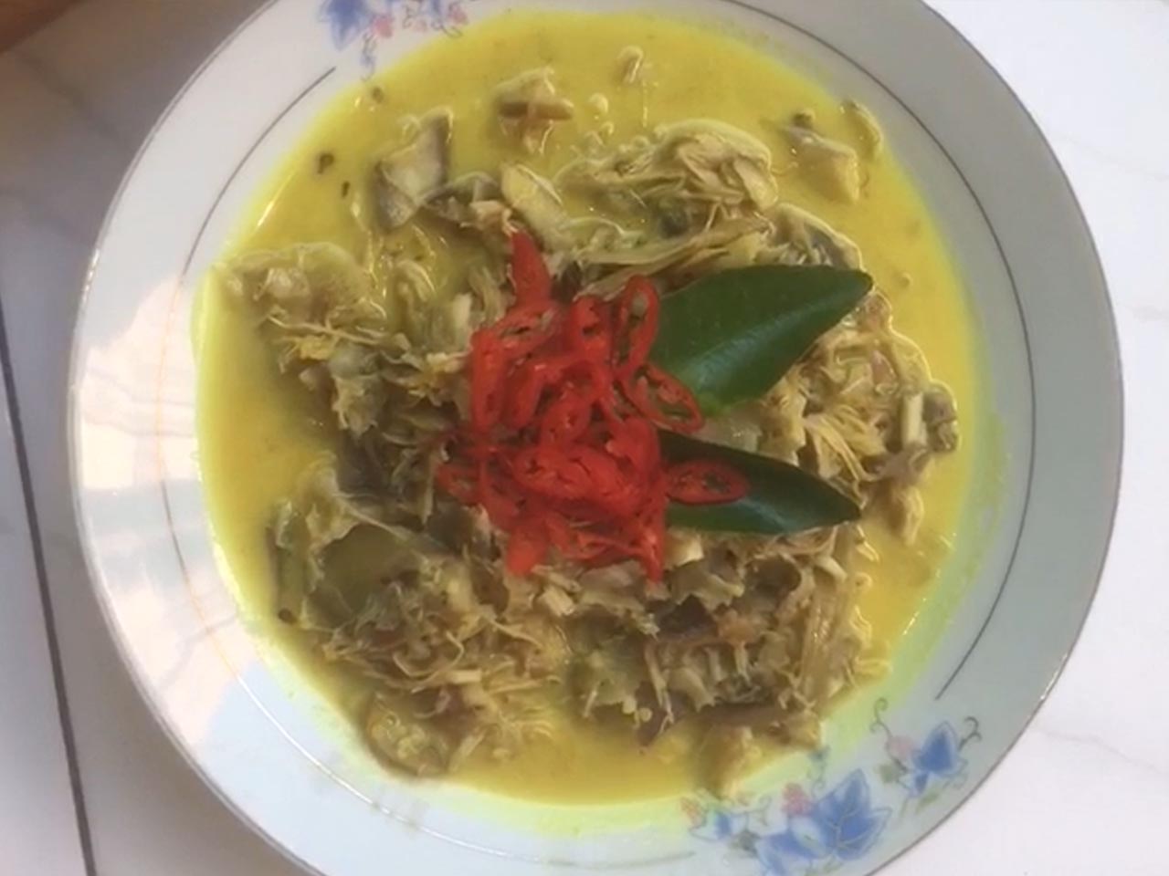 Indonesian Banana Blossom in Coconut Milk On Her Table